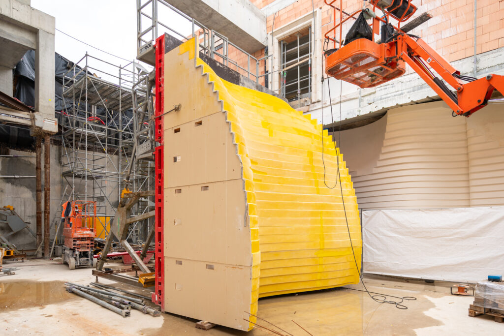Wine cellar architecture: custom-made formwork for signature projects 10 Winery architecture: Custom-built formwork reinforced on site to create curved stepped exposed concrete walls for a winery in France.